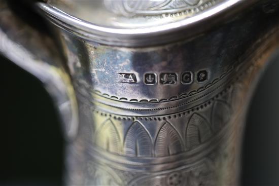 A Victorian engraved silver baluster hot water/claret jug, by Atkin Brothers, 18.5oz.